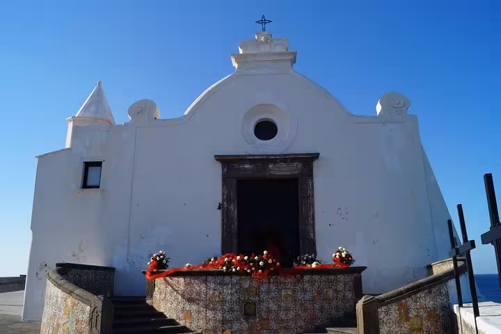 Charming historic church with floral decorations on Procida Island, ideal stop on a Naples boat tour.