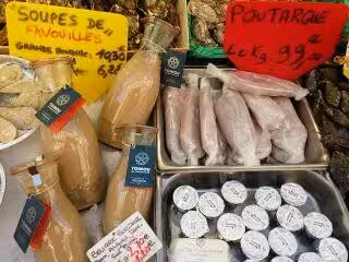 Provençal market delicacies in Aix-en-Provence, featuring tapenade, seafood and gourmet tour tastings