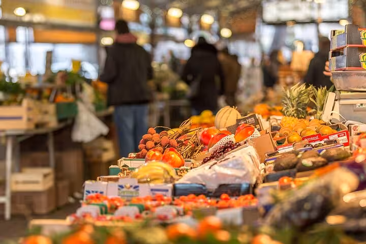 Vibrant Provencal market stall in Cannes filled with fresh fruits and local produce.