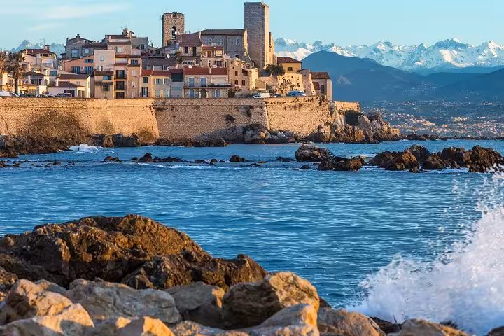 Scenic view of Antibes with historic architecture and the Mediterranean Sea, ideal for a Provencal market experience.