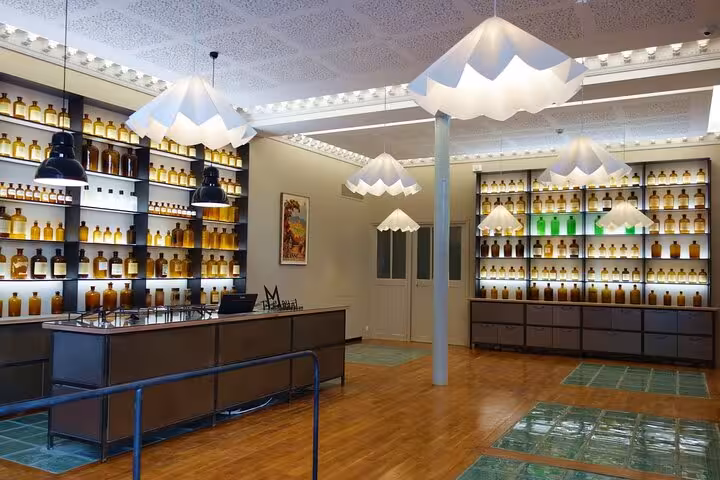 Bright interior of a Provencal perfume shop with shelves of bottles, showcasing local craftsmanship and elegance.