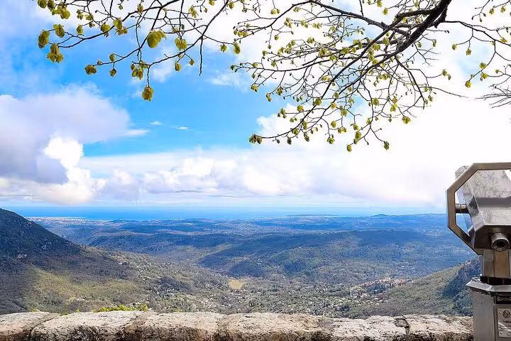 Scenic viewpoint in Provence offering panoramic views of lush countryside and distant horizon.
