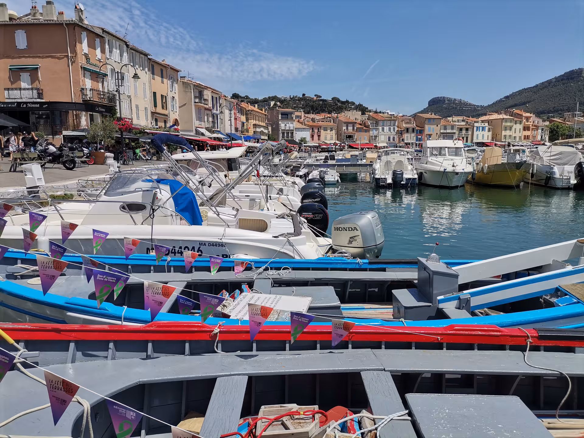 Provence harbor with fishing boats and pastel waterfront, scenic cultural stop on 14-day heritage tour