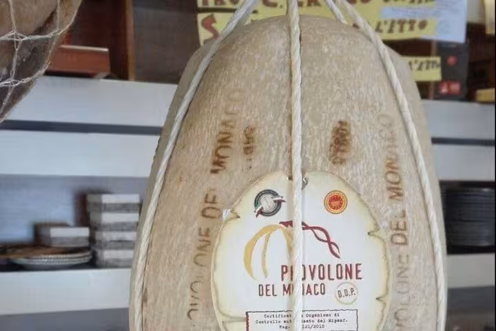 Authentic Provolone del Monaco cheese showcasing Italian craftsmanship, featured in the Sorrento food tour.