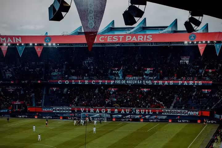 PSG matchday atmosphere inside Parc des Princes, Paris Saint Germain game with packed stands and banners