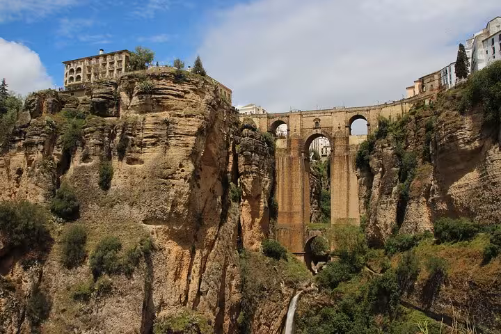 Beautiful view of Puente Nuevo bridge spanning a dramatic gorge in Ronda, a highlight of Andalusia's breathtaking landscapes.