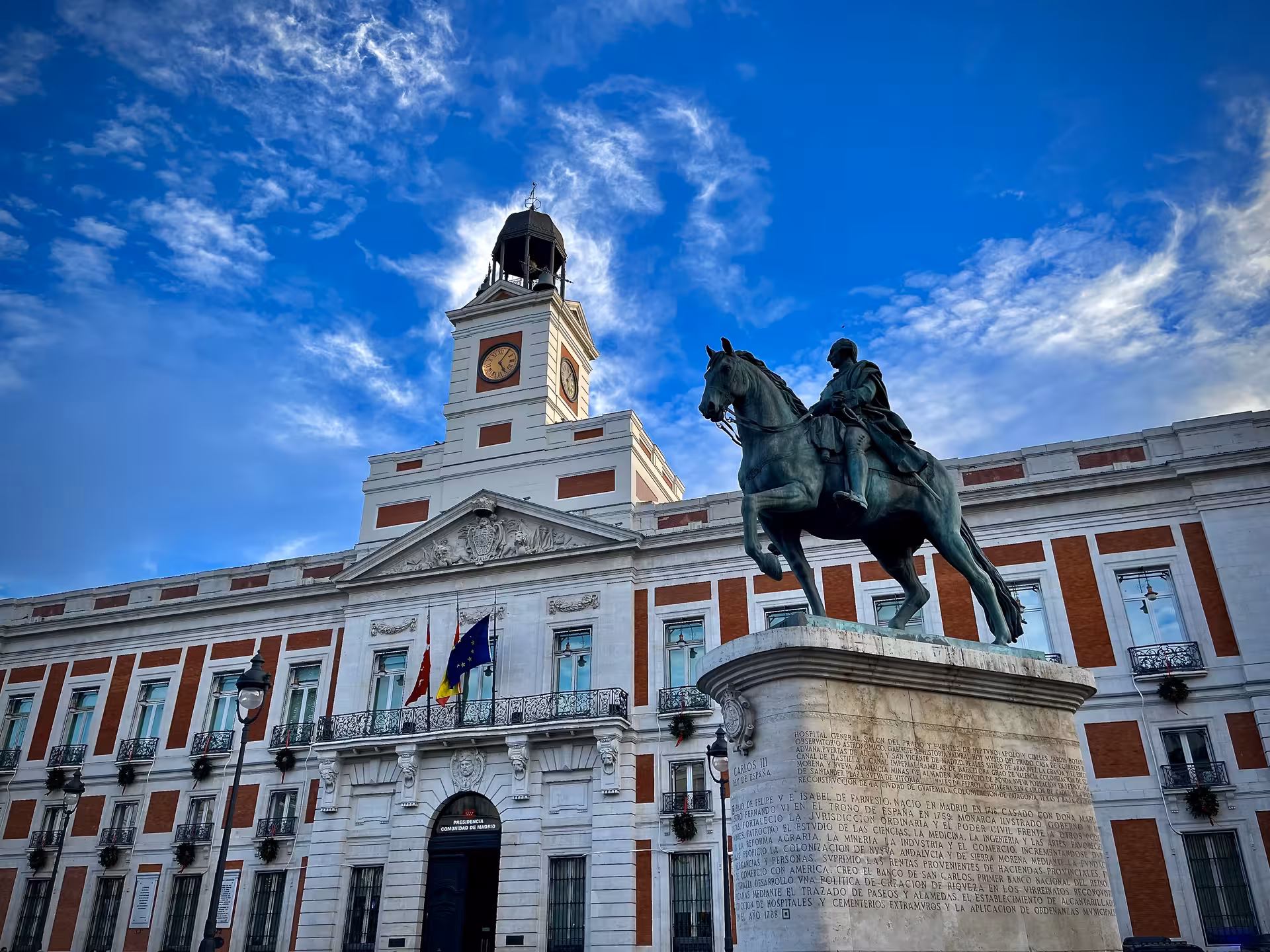 Puerta del Sol Madrid with Real Casa de Correos and equestrian statue, must-see on local charms tour before tablao flamenco