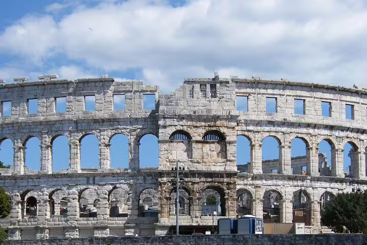 Close-up of Pula Arena Roman amphitheater arches in Croatia, main entrance view for admission ticket visitors