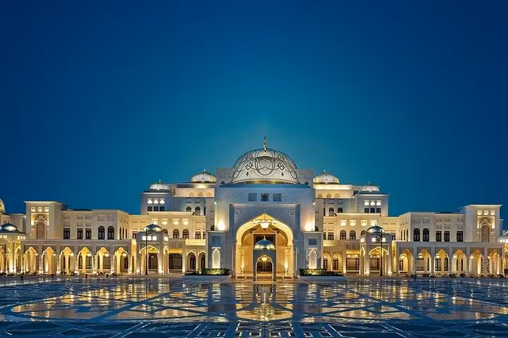 Qasr Al Watan lit at night with reflections, highlight of a private full-day Abu Dhabi city tour from Abu Dhabi