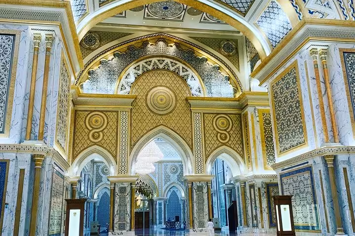 Qasr Al Watan palace interior in Abu Dhabi, ornate gold arches and mosaics on guided city tour entry