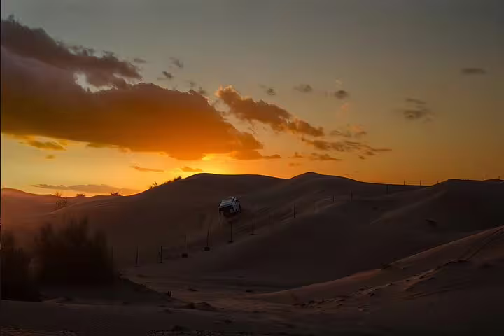 Golden Dunes Qatar Safari: Sunset Adventure & Thrilling Dune Bashing.