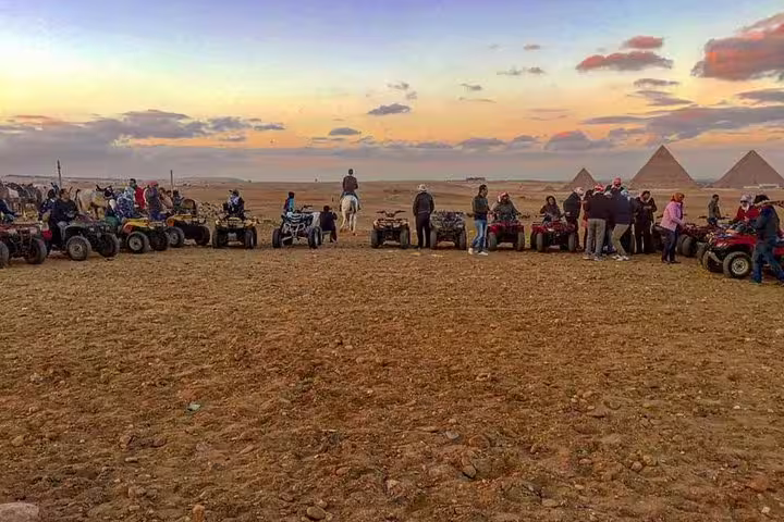 Sunset quad bike desert safari near Giza Pyramids with riders lined up for Egypt adventure
