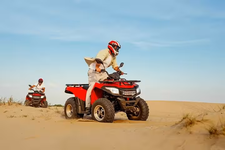 Quad biking across Sinai desert dunes in Sharm El Sheikh, thrilling ATV safari adventure tour