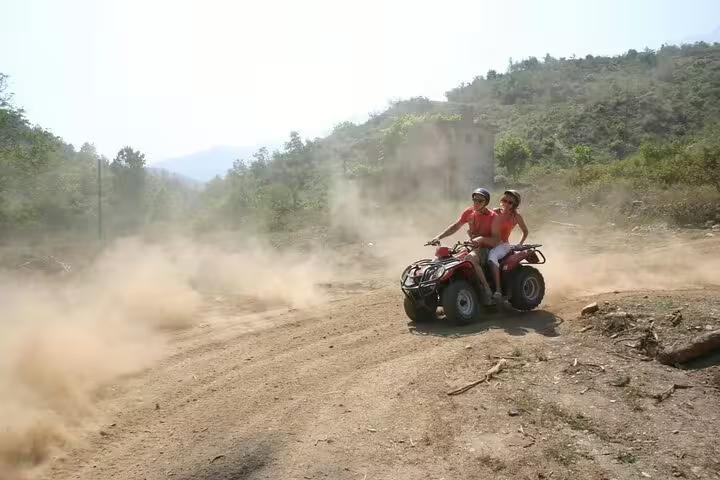 Cruise guests experience an exhilarating quad ride through dusty trails and scenic views near Kusadasi Port.