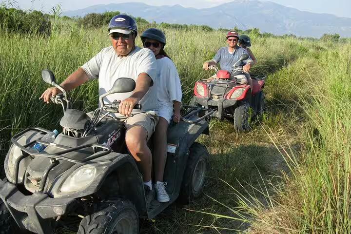 Tourists ride quads along lush trails near Kusadasi Port, offering an adventurous excursion for cruise visitors.