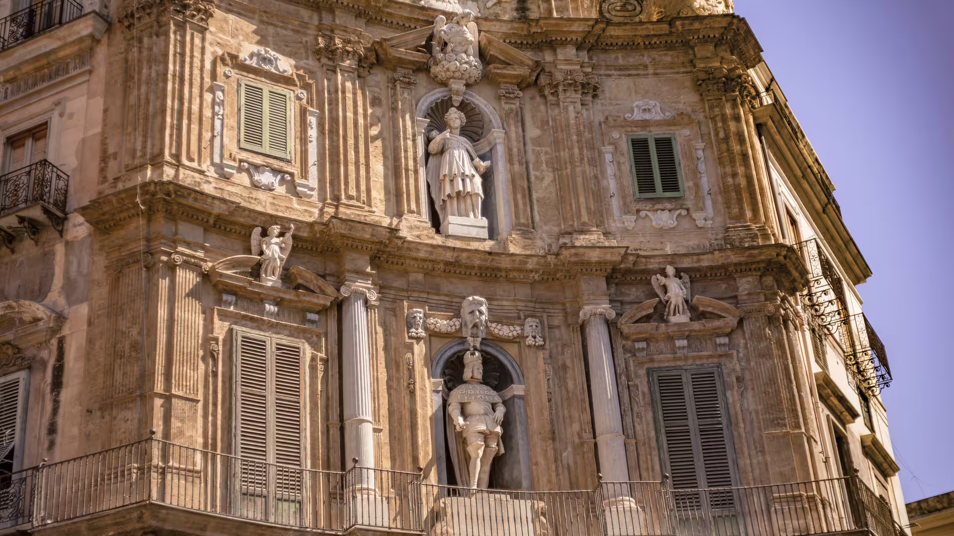 Baroque facade with statues and balconies at Quattro Canti, a highlight of private Monreale and Palermo city tours