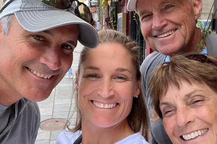Group selfie on Old Quebec pedestrian street during Quebec City scavenger hunt and city highlights walking tour