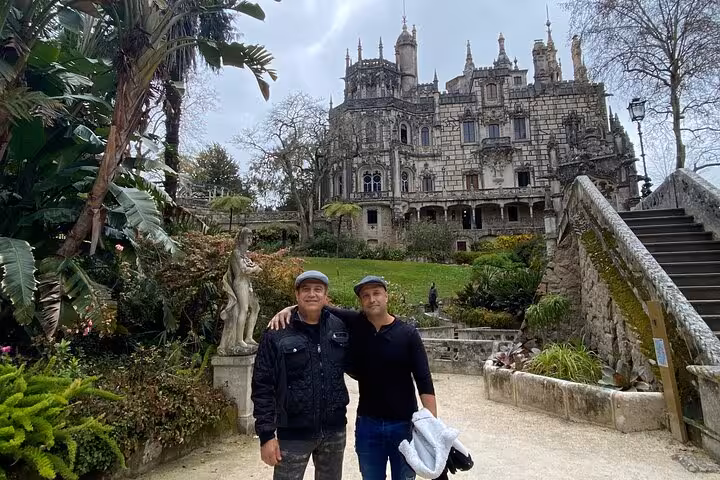 Visit the stunning Quinta da Regaleira Palace on a guided Sintra tour, showcasing its lush gardens and intricate architecture.