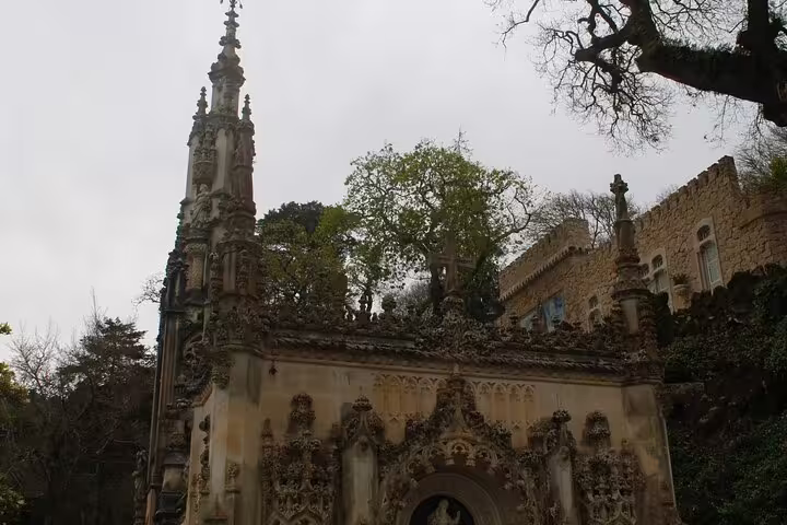 Intricate architectural details of Quinta da Regaleira in Sintra, featuring Gothic elements, on a day trip from Lisbon.