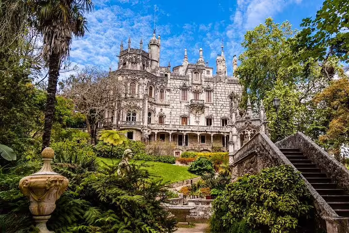 Quinta da Regaleira in Sintra, Portugal, with lush gardens and gothic architecture, featured on a private half-day UNESCO tour.