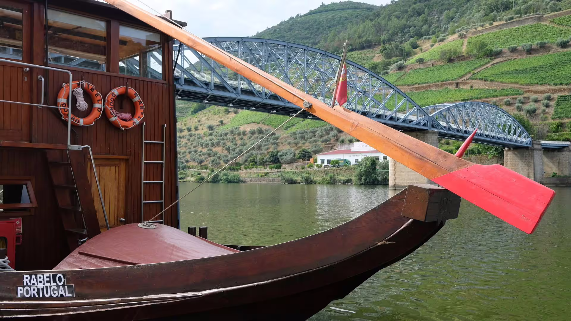 Image of a moored Rabelo Boat in Pinhão on Cooltour Oporto's Douro Valley Wine Tour from Porto