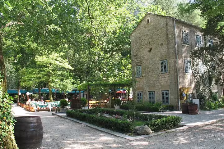 Stone mill building in Radmanove Mlinice, scenic stop on Omiš and Cetina River boat tour from Makarska