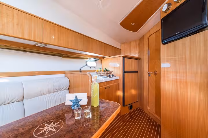 Luxurious interior of Raffaelli Shamal 40 yacht with elegant wood finish, ideal for a Capri tour from Sorrento.