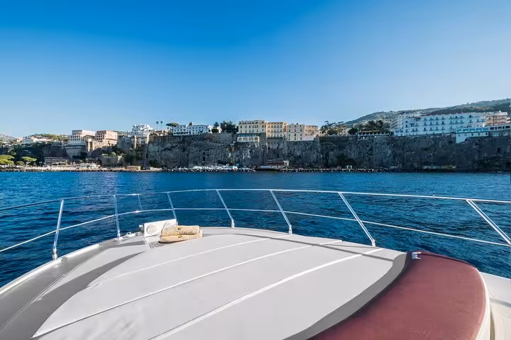 Scenic view from the deck of Raffaelli Shamal 40 yacht overlooking the Sorrento coast on a private Capri tour.