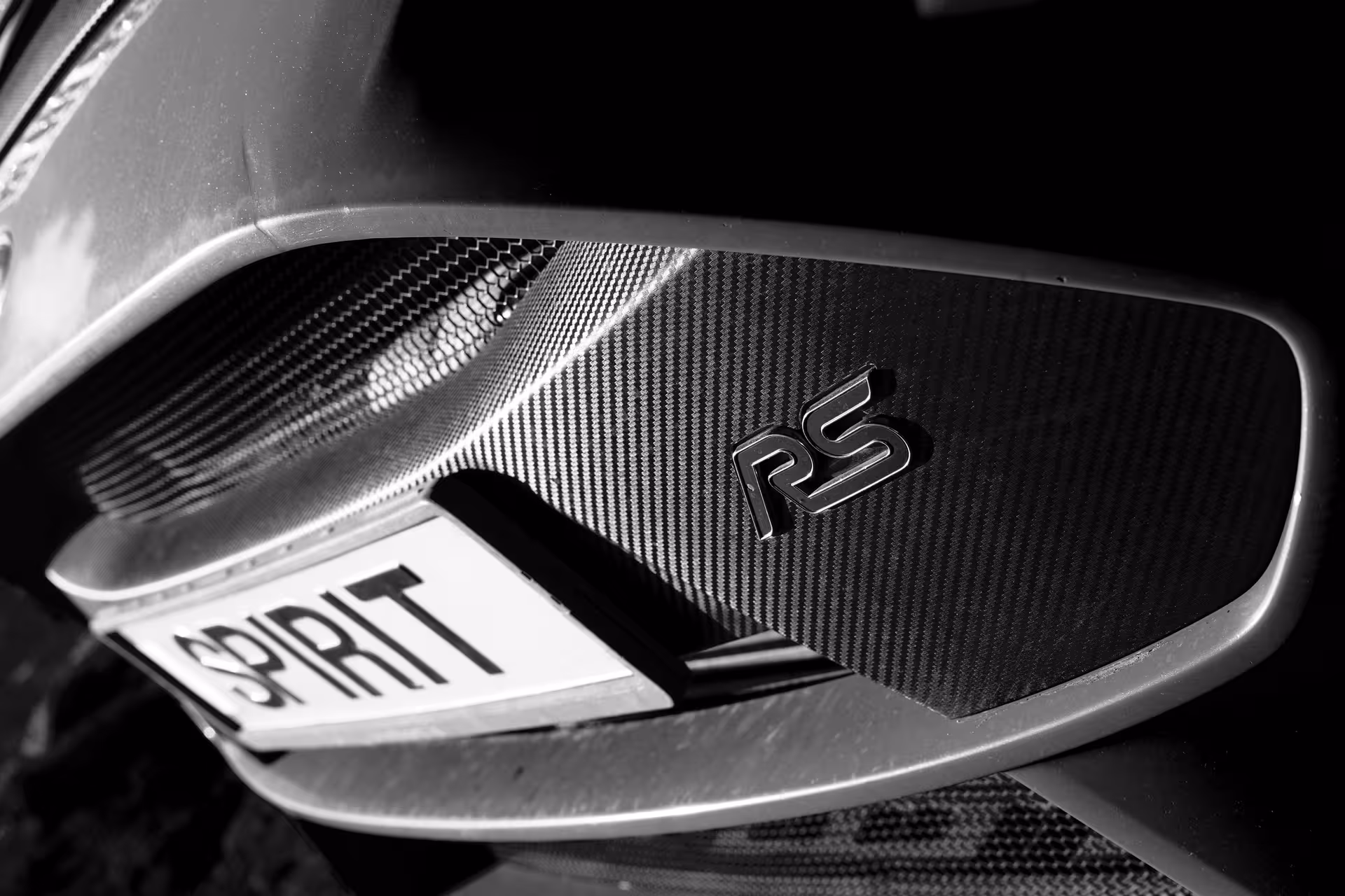 Carbon fiber RS badge and rear detail of rally car, Golden Circle Rally Car Experience in Iceland