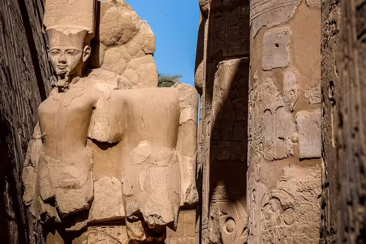 Massive Ramesses II statue in Karnak Temple, Luxor, featured on 3 days 2 nights VIP train trip from Cairo