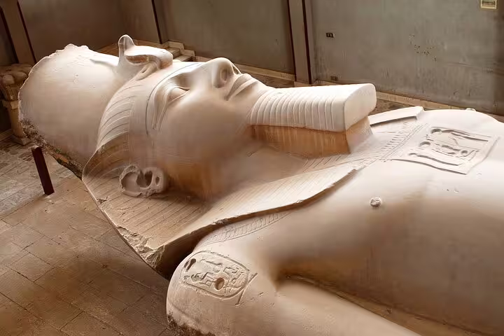 Colossal limestone statue of Ramses II at Memphis open-air museum on Dahshur Pyramid and Memphis tour