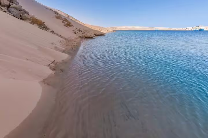 Sandy shoreline and calm lagoon at Ras Mohammed National Park on half-day bus trip from Sharm El Sheikh