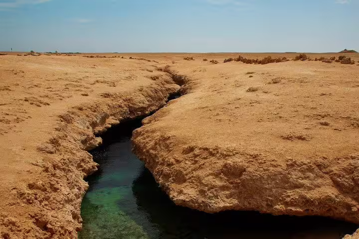 Ras Mohammed National Park crack in desert with clear seawater, half-day bus tour from Sharm El Sheikh