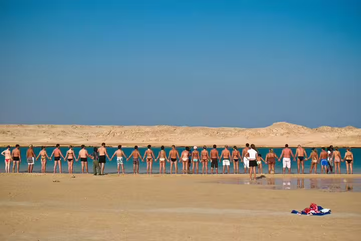 Tour group on sandy beach at Ras Mohammed National Park, Sharm El Sheikh, on a private day trip