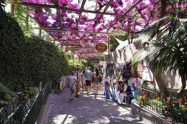 Picturesque walkway with blooming bougainvillea in Ravello, a scenic stop on an Amalfi Coast tour from Sorrento.