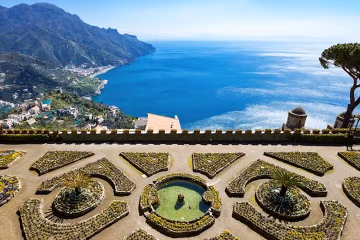 Scenic view of Ravello's gardens overlooking the Amalfi Coast and Mediterranean Sea, ideal for Positano day tours.