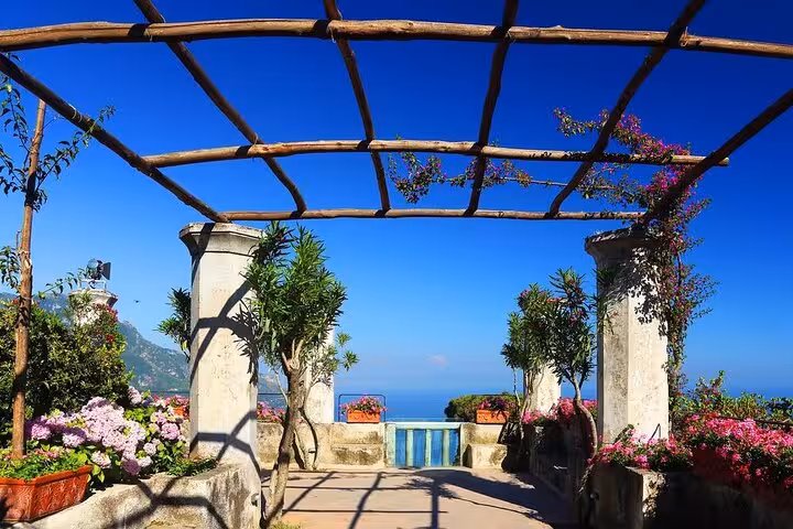 Scenic terrace in Ravello featuring lush gardens and panoramic sea views, ideal for an unforgettable half-day tour.