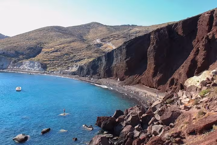 Red Beach Santorini cliffs and turquoise bay scenery on a private half-day sightseeing tour with pickup
