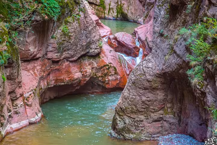 Picturesque Red Canyon with vibrant rock formations and serene water, perfect for a private full-day tour.