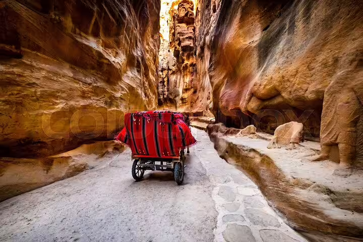 Red carriage through Petra Siq gorge, Jordan day trip from Sharm El Sheikh with guided sightseeing