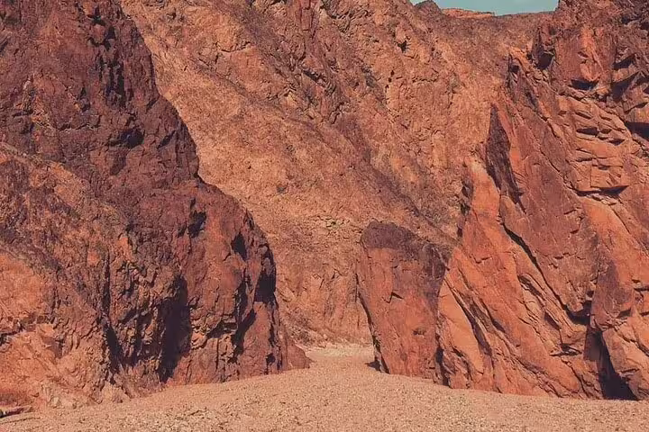 Red granite canyon cliffs in Sinai Desert on private jeep safari to Lost Lake and Dahab from Sharm El Sheikh