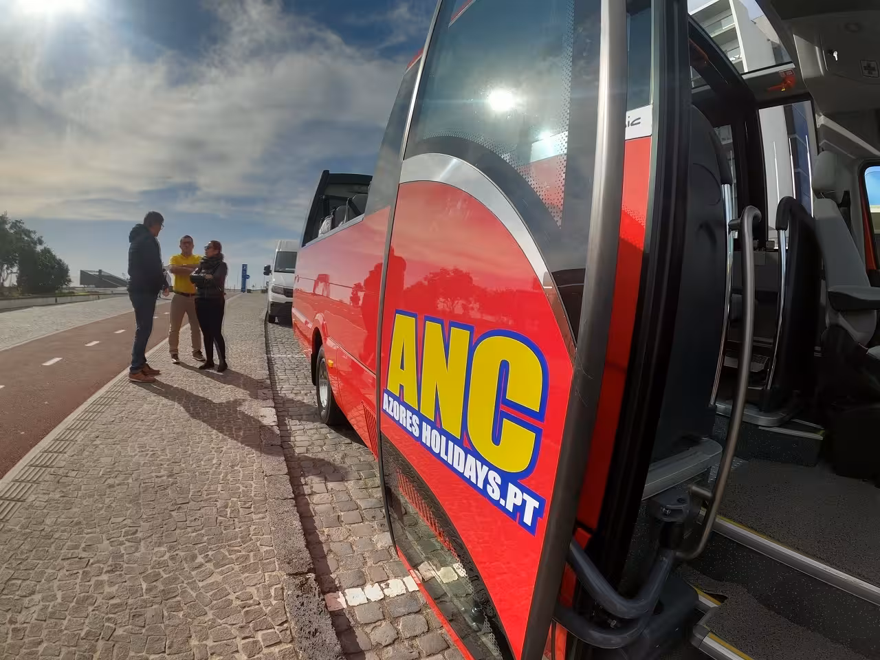 Red minibus pickup for Northeast scenic village full-day tour, Azores transport with open door