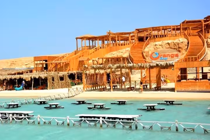 Scenic beachfront resort on the Red Sea with wooden structures, ideal for relaxation during a 13-day Cairo tour.