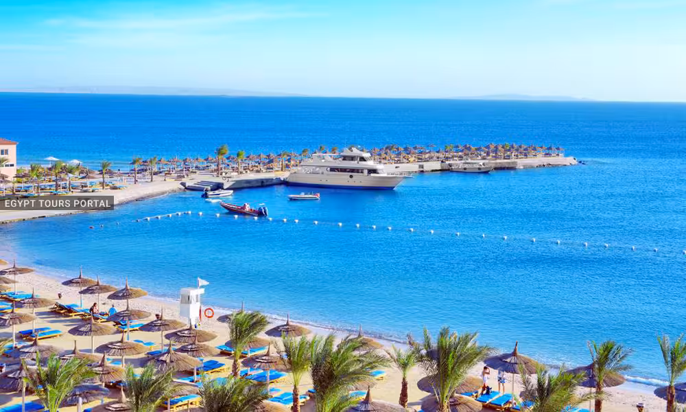 Red Sea resort beach in Hurghada with yacht marina and sunbeds, start of 15-day Egypt tour package