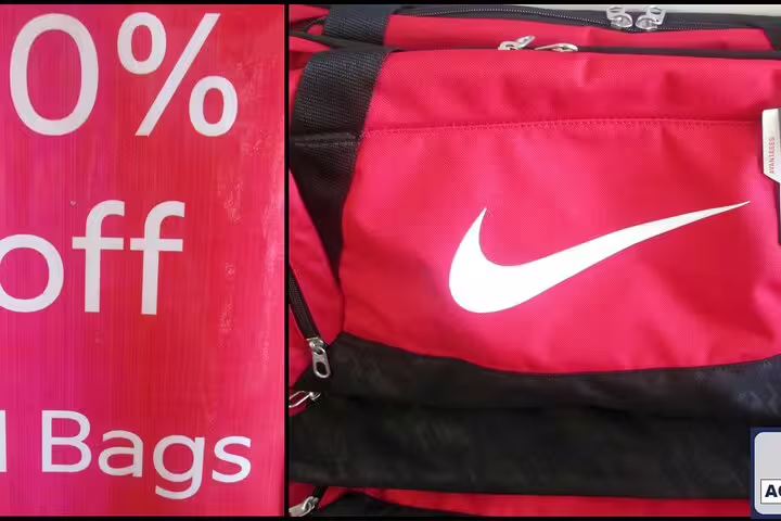 Red sports bag with Nike logo on sale, highlighting discount shopping opportunities in Cape Town tour.