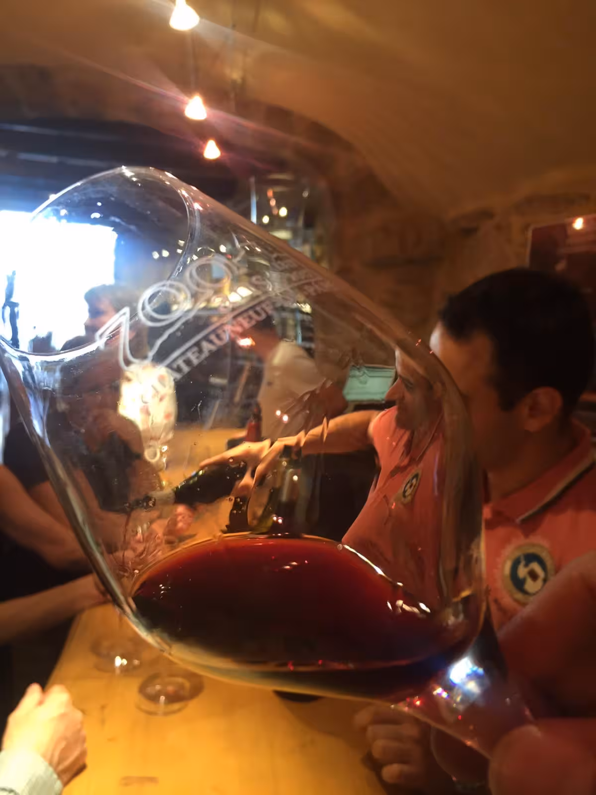 Close-up of red wine glass tasting in Avignon, Châteauneuf-du-Pape winery visit on Rhône Valley tour