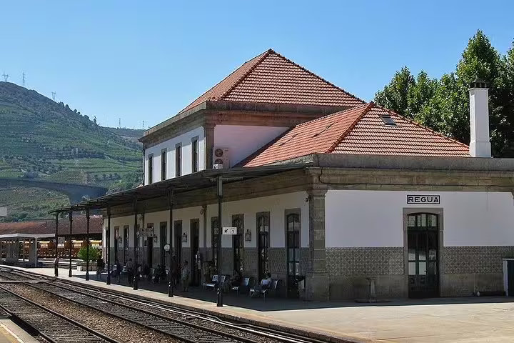 Charming Régua train station with traditional architecture, a key stop on the Porto day trip itinerary.