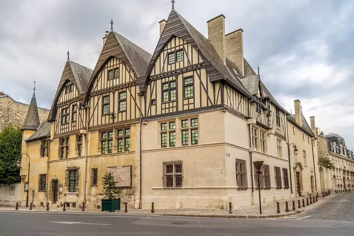 Historic half-timbered building in Reims, France, showcasing medieval architecture on a Champagne day trip from Paris.