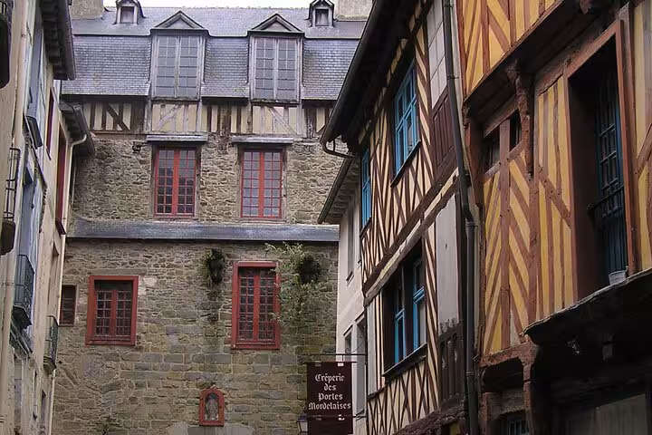 Admire the charming timber-framed buildings in Rennes' city center during a private guided walking tour.