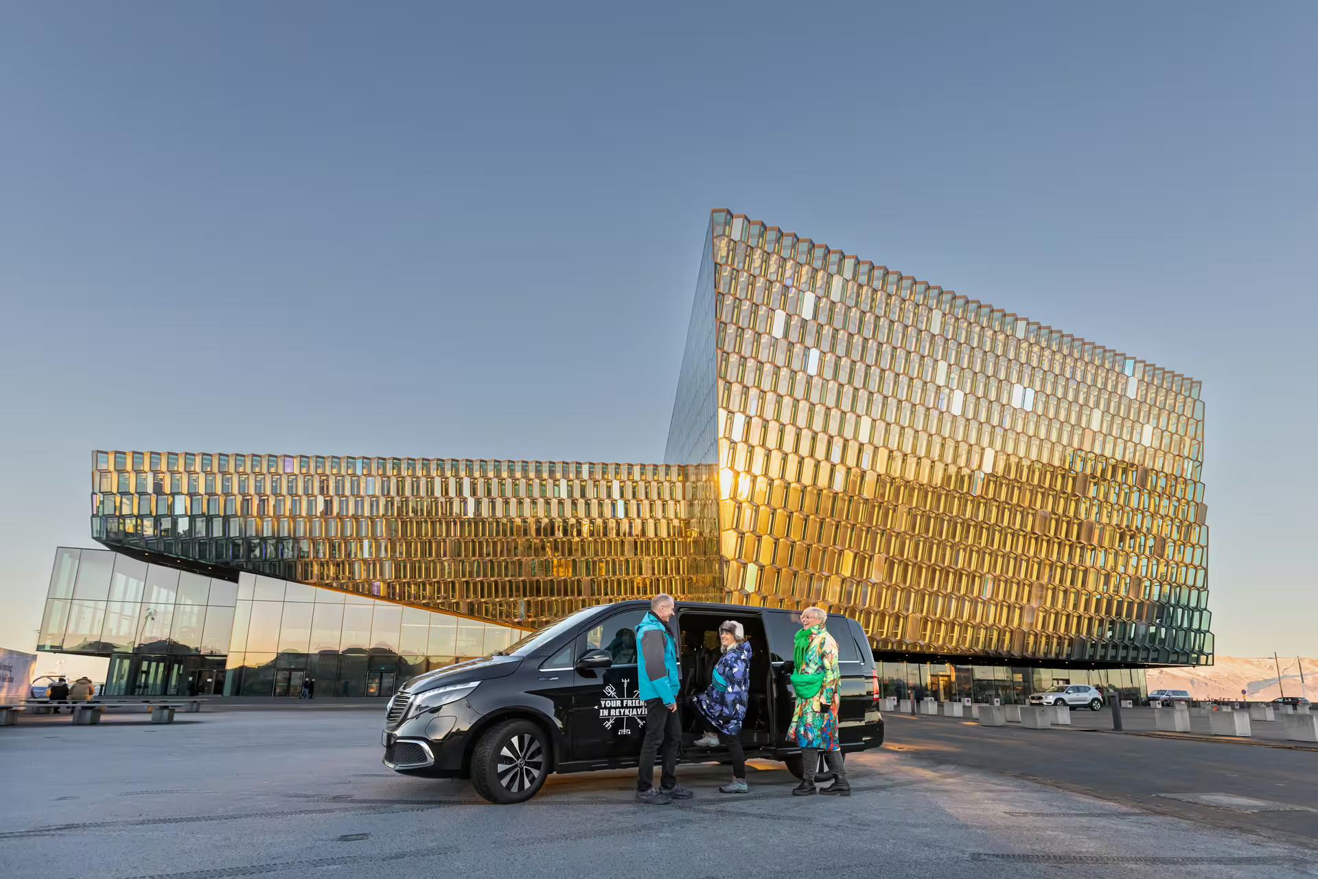 Group of travellers meeting the Guide from Your Friend in Reykjavik in front of the Harpa Concert Hall 